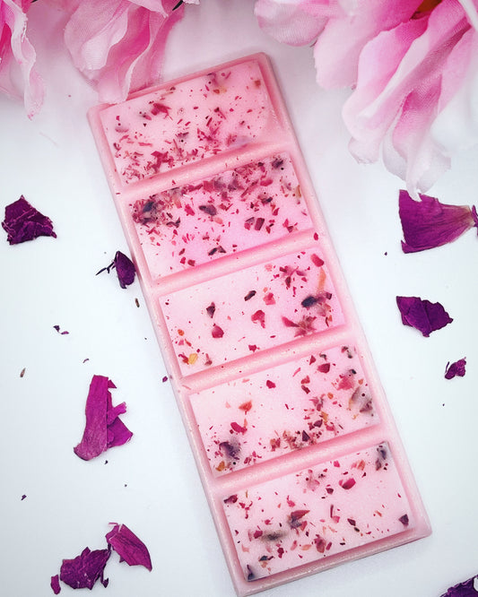 Pink wax snap bar with rose petals.