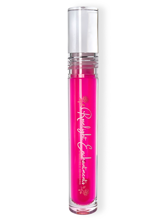 Pink lip gloss with the branding "Roselight Enchantments"